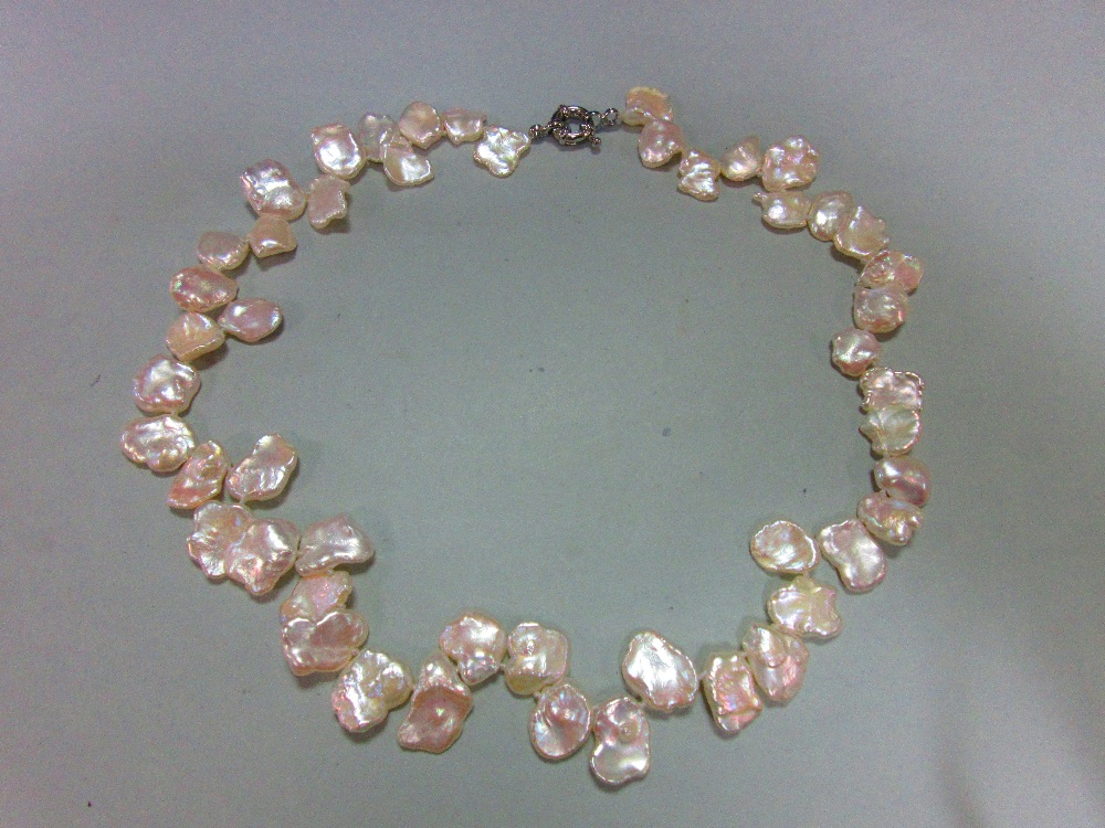 A 'cornflake' cultured pearl necklace, the creamy white flake-shaped pearls individually knotted,
