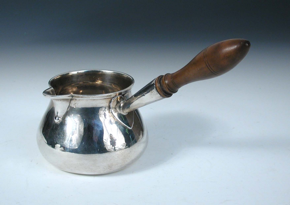 A George III silver brandy saucepan, by Charles Wright, London 1773, of plain baluster form with