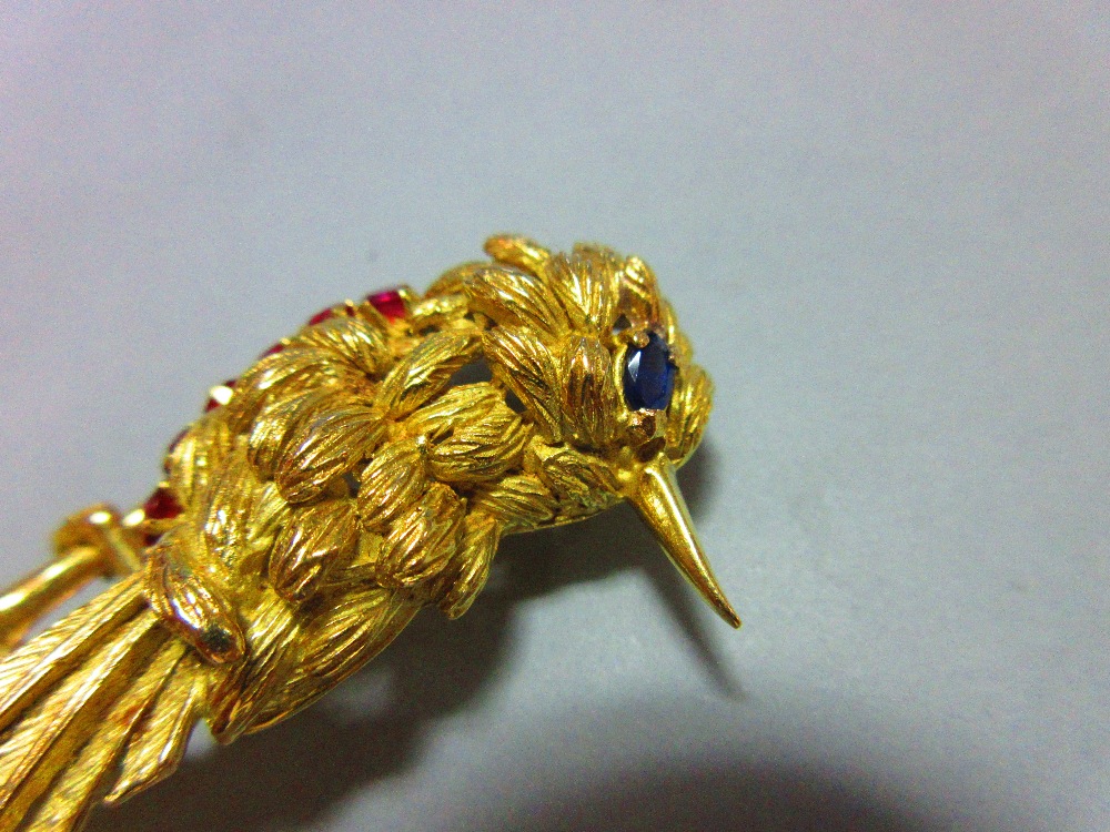 A ruby and sapphire bird brooch, the realistically modelled exotic bird with textured feathers, oval - Image 5 of 5