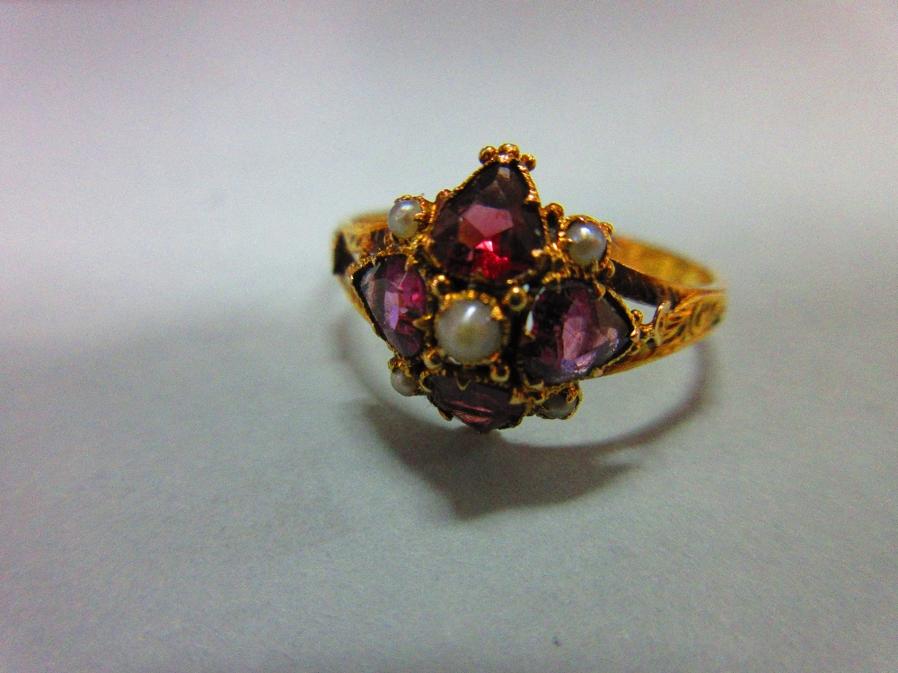 A mid Victorian 15ct gold, garnet and seed pearl quatrefoil ring, with four heart cut almandine - Image 2 of 6