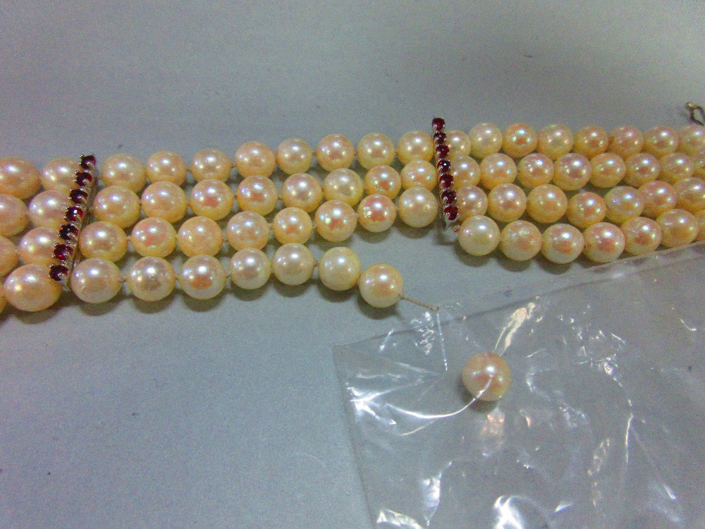 A four row pearl bracelet with feature clasp, the uniform 6.5mm pearls (one strand broken, one loose - Image 6 of 6