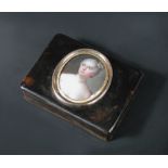 An early 19th century tortoiseshell portrait snuff box of rectangular form, the cover applied with