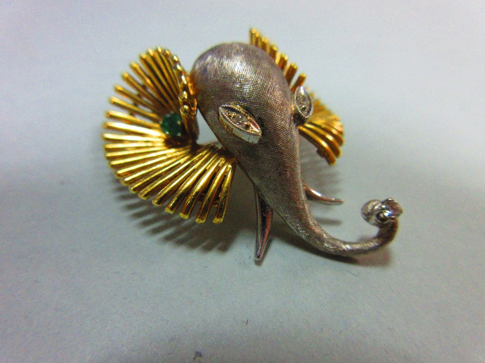 A bi-coloured precious metal, diamond and emerald set elephant head brooch, designed as a white - Image 2 of 6