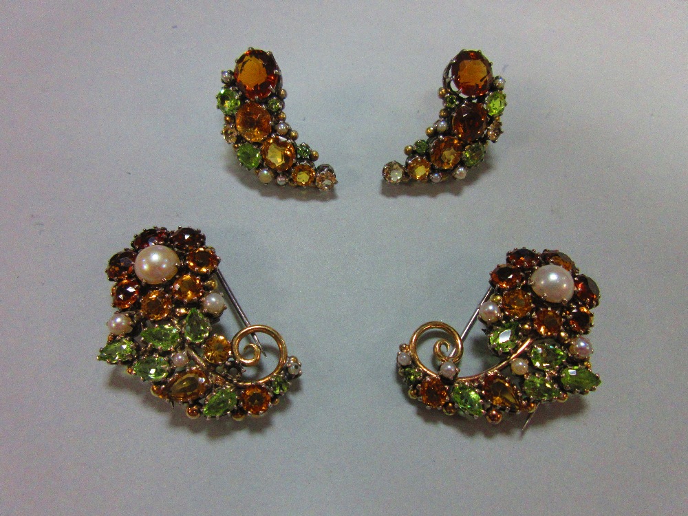 A suite of mid 20th century multi gem set dress clips and earrings believed to be by Dorrie