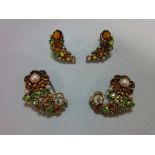A suite of mid 20th century multi gem set dress clips and earrings believed to be by Dorrie