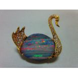 An opal and diamond brooch in the form of a swan, the body of the swimming bird formed by an ovoid