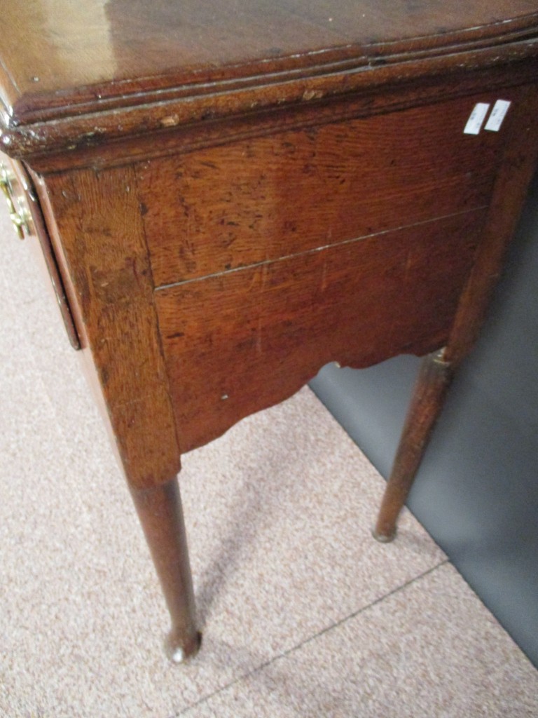 A George III oak dresser base, fitted three drawers with brass handles, shaped fret carved apron - Image 4 of 5