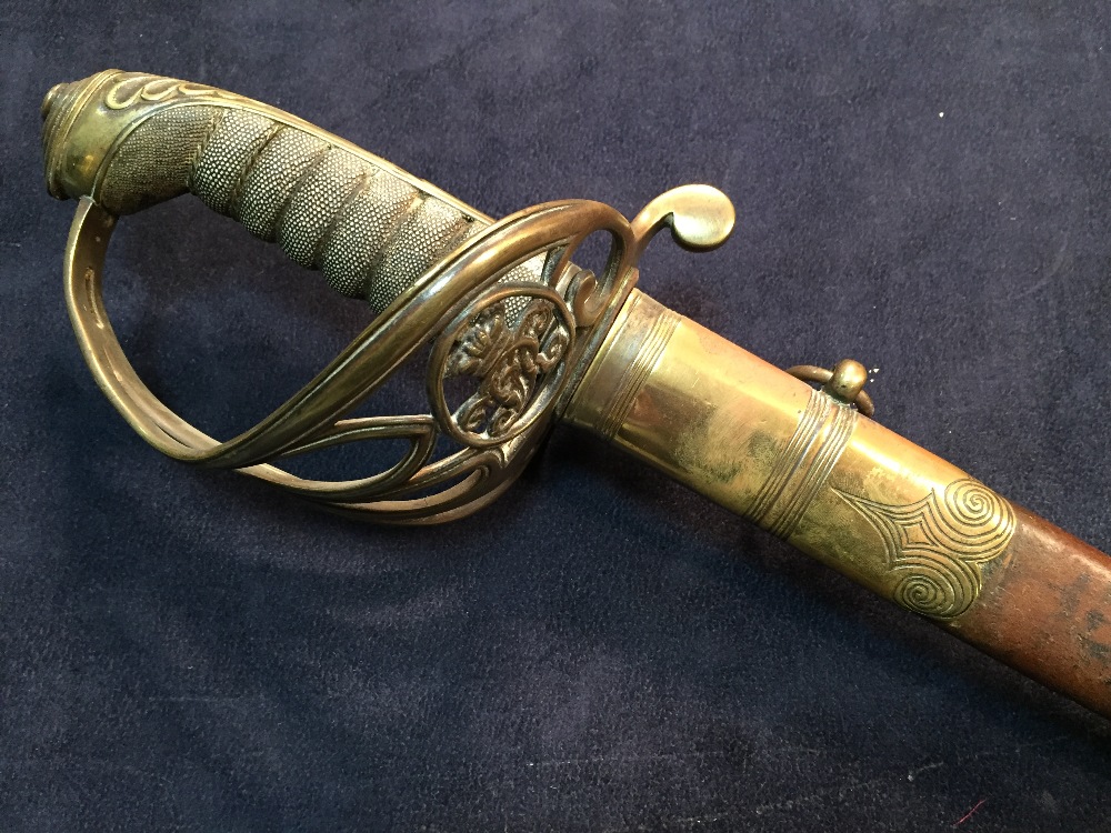 A Victorian officer's sword by Mole, with undecorated blade, pierced guard with cipher in a