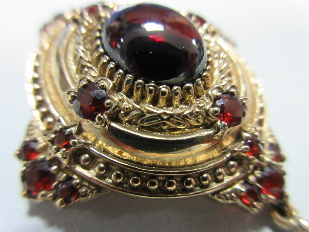 A gold and garnet Holbeinesque pendant / brooch, of oval tiered form, set to the cardinal points - Image 6 of 6