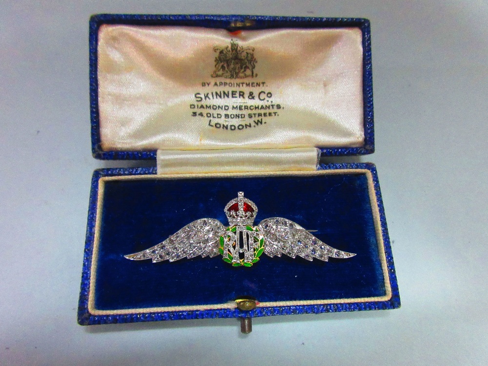 A regimental diamond and enamel RAF brooch, the outspread wings, crown and RAF initials set with