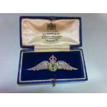 A regimental diamond and enamel RAF brooch, the outspread wings, crown and RAF initials set with