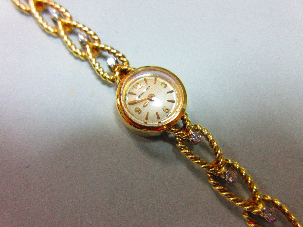 A Jaeger-LeCoultre lady's 18ct gold wristwatch with diamond set bracelet, the small circular cream - Image 2 of 6