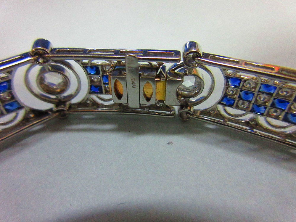 An art deco diamond and sapphire bracelet, designed as nine geometric pierced panels with a - Image 5 of 8