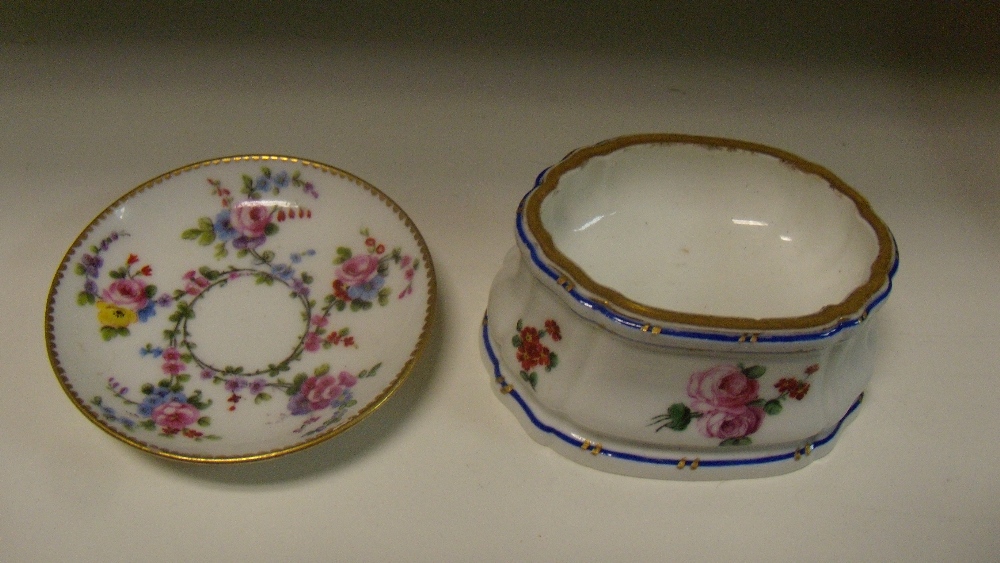 An 18th century Sevres trencher salt together with a small dish painted respectively by Morin and