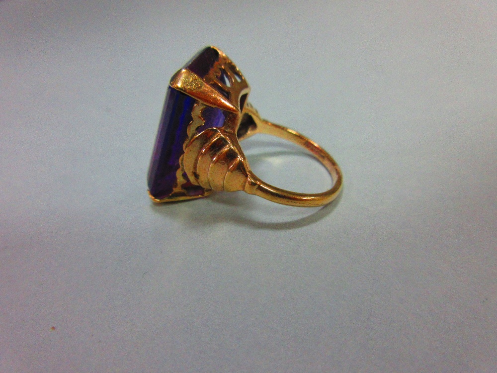 A synthetic colour change sapphire ring, the large step cut stone appearing blue in daylight and - Image 3 of 4