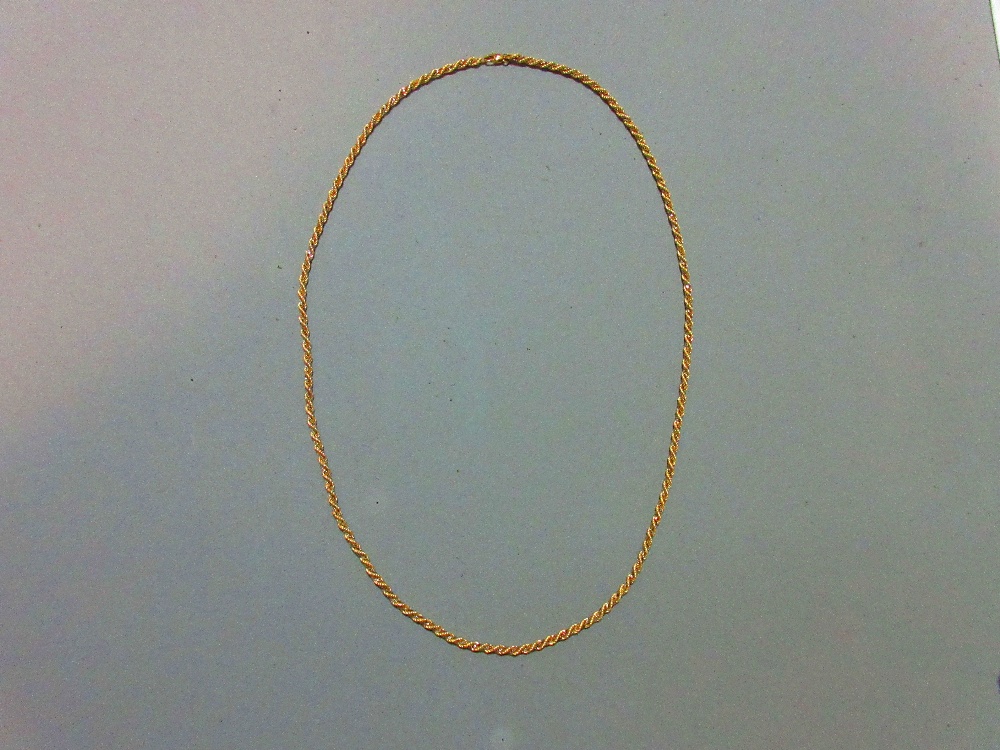 An Italian bi-coloured ropetwist necklace marked for 18ct gold, stamped '750' and with partial