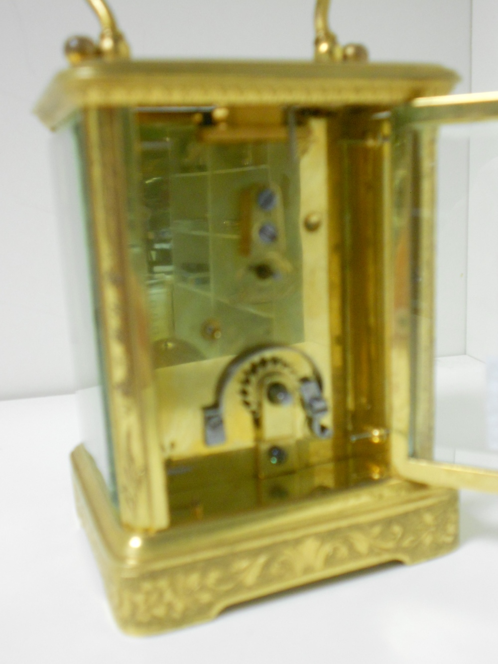 A small French gilt brass carriage timepiece, with floral scroll engraved case and 4.5cm rectangular - Image 3 of 4