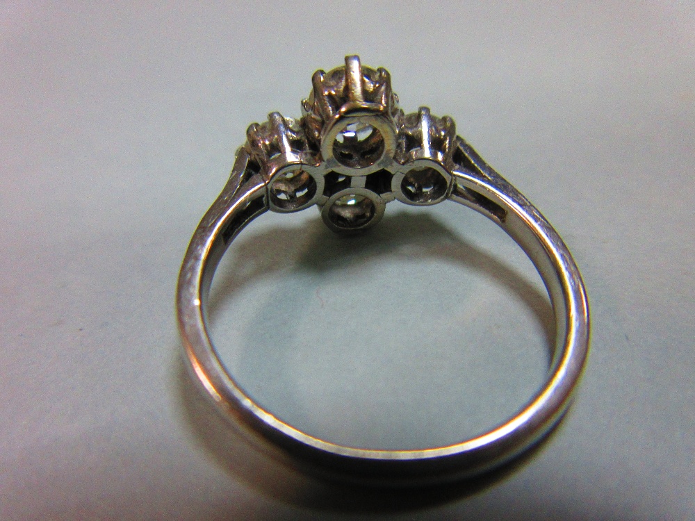 An unusual four stone diamond ring, the old round brilliant cut diamonds claw set in a horizontal - Image 4 of 7