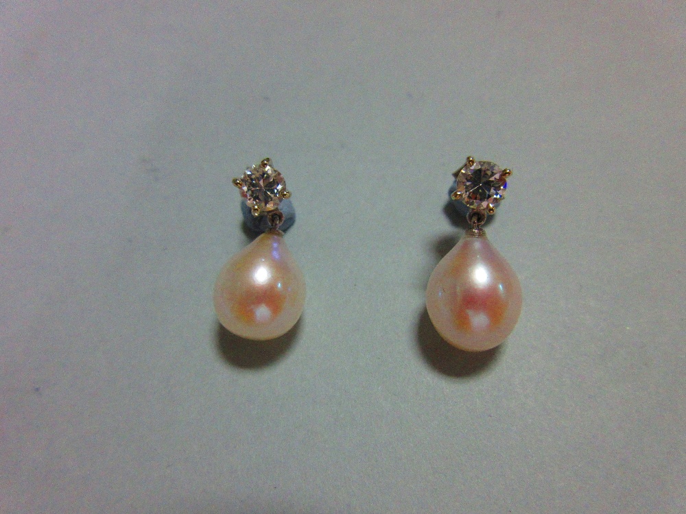 A pair of diamond earstuds with removeable pearl drops, each post of hallmarked 18ct white gold