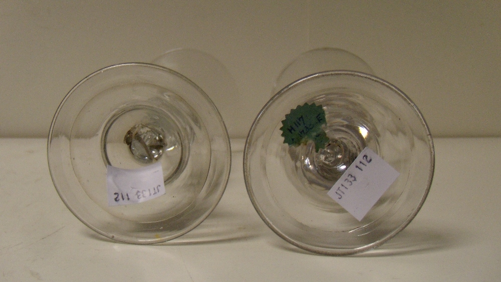 Two 18th century European wine glasses, each with hollow stems and on folded feet, one with bell - Image 2 of 2