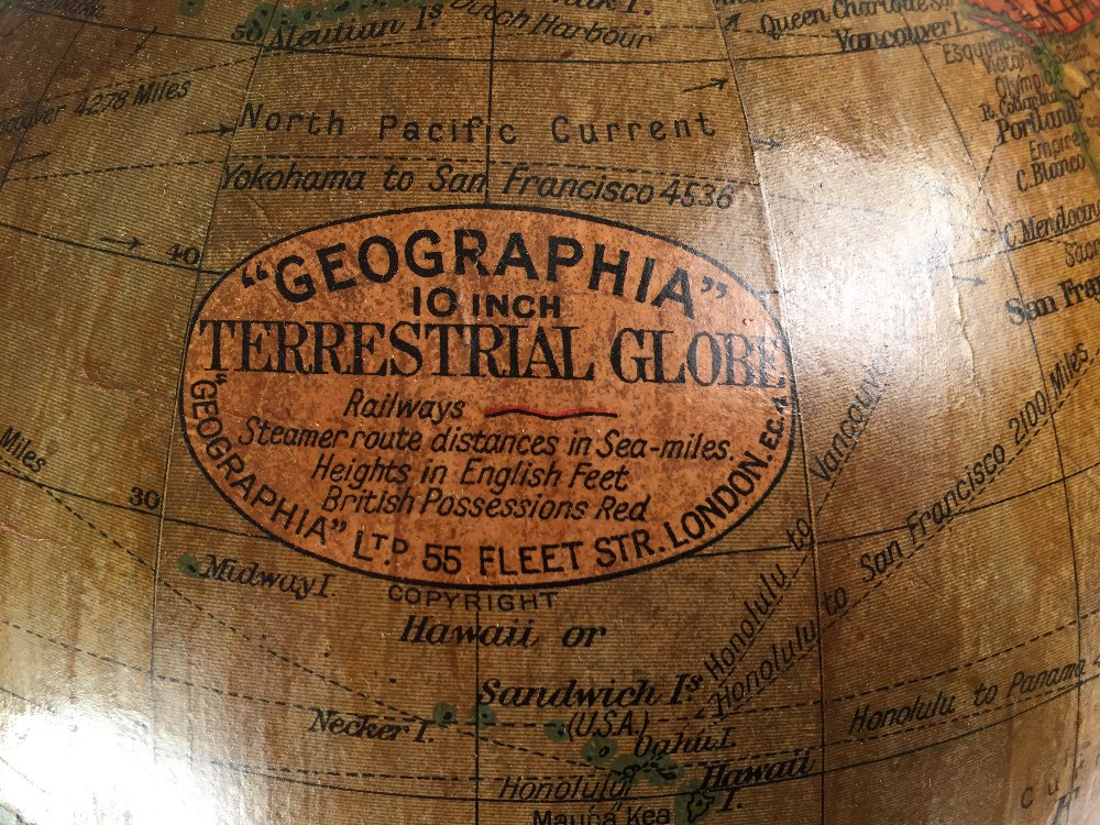 A Geographia 10 inch terrestial globe, early 20th century, supported on a gilt metal figure of Atlas - Image 2 of 3