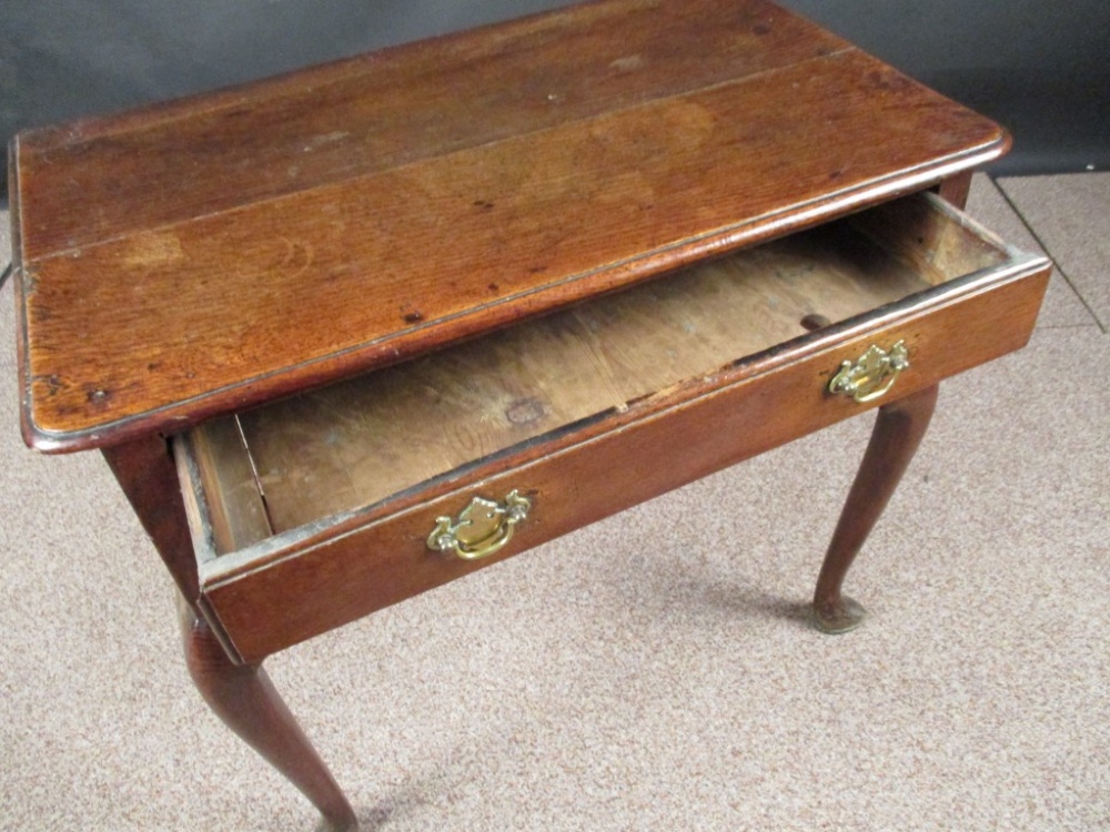 A Queen Anne oak lowboy, fitted one drawer, brass plate handles, fret carved frieze with central - Image 2 of 6