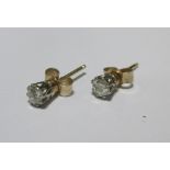 A pair of old cut single stone diamond earstuds, claw set in yellow metal, total estimated weight