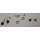 Four pairs of cultured pearl ear studs, a pair of grey cultured pearl earrings and another pair