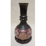 A 19th century Imari vase with lacquered neck, 37.5cm together with a wood stand (2)