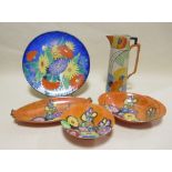 Three pieces of Carlton ware 'Hollyhocks' lustre ware, a Carltonware charger and an early 20th
