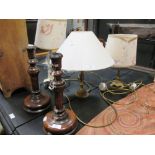 A pair of turned oak table candlesticks and three assorted table lamps (5)