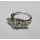 A triple diamond cluster ring, the three diamond clusters set to a twisting gallery down to a