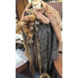 A ladys three-quarter length brown fur coat, a pale tawny coloured fur cape and a fur stole (3)