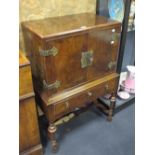 A walnut 1920's Queen Anne revival cabinet on stand, 114 cm high x 76 cm wide