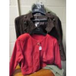 A green suede coat with matching shoes together with a new brown suede jacket and a bright red suede