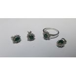 An emerald and diamond suite, comprising ring, pendant and earstuds, all with an oval cut emerald in