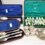 A quantity of silver items to include napkin rings, cased berry spoons, teaspoons, etc
