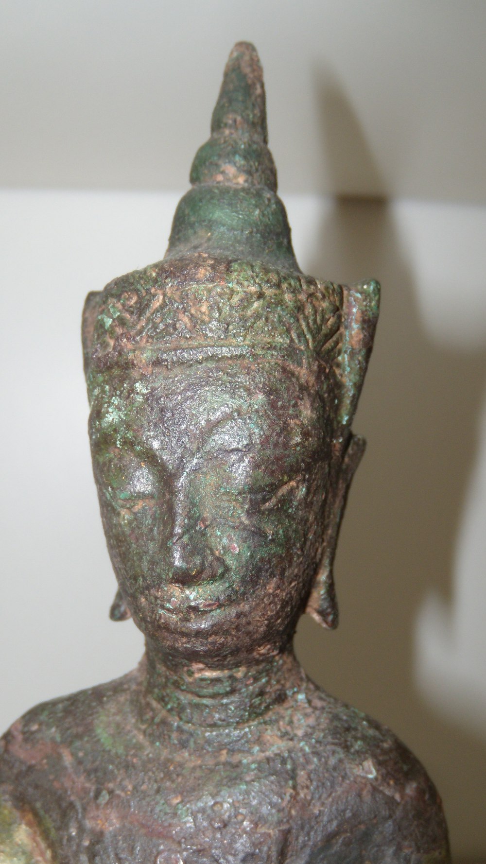 A 16th/17th century bronze Buddha from Ayuthia, Thailand, 20cm (8 in) high  A lable on the wood - Image 3 of 4