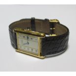 A lady's Must de Cartier silver gilt Tank wristwatch, the champagane coloured square dial with Roman