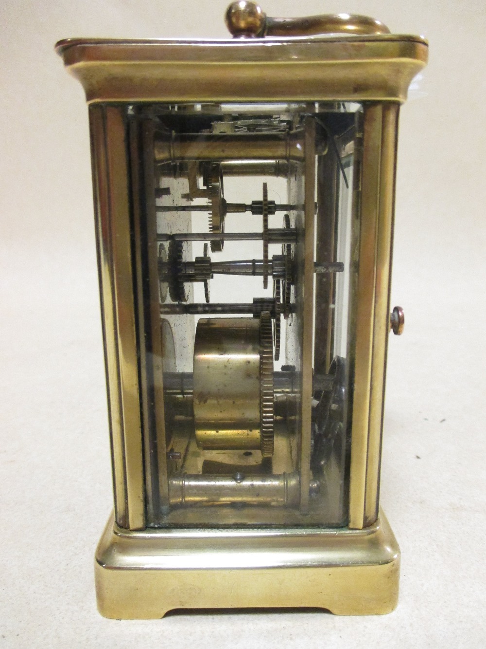 A brass cased carriage clock with white dial and black Roman numerals, 11.5cm high handle down - Image 2 of 4