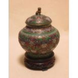 A Chinese open work cloisonne jar, cover and wood stand, 22cm high the jar