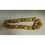 A 20th century Chinese scratch carved bone bead necklace  Good
