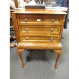 A mahogany three drawer canteen cabinet on cabriole legs and various mainly EPNS contents