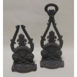 A pair of 19th century cast iron door stops, one a/f