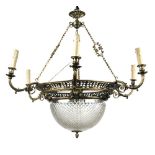 An Edwardian silvered brass and cut glass electrolier, the frame with pierced scrollwork and