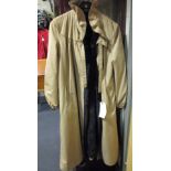 A ladys full length dark brown fur coat with a mackintosh style outer layer / reversible