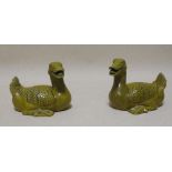 A pair of Qianlong style olive green porcelain ducks, approximately 14cm wide (2)