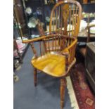 A modern oversized yewwood Windsor armchair with crinoline stretcher, stamped Tom Priestley,125cm