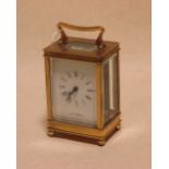 A brass cased carriage clock, 13cm handle down