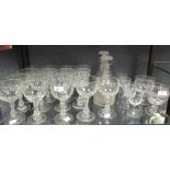 Two George III triple ring neck decanters, together with a quantity of 19th century wine glasses and